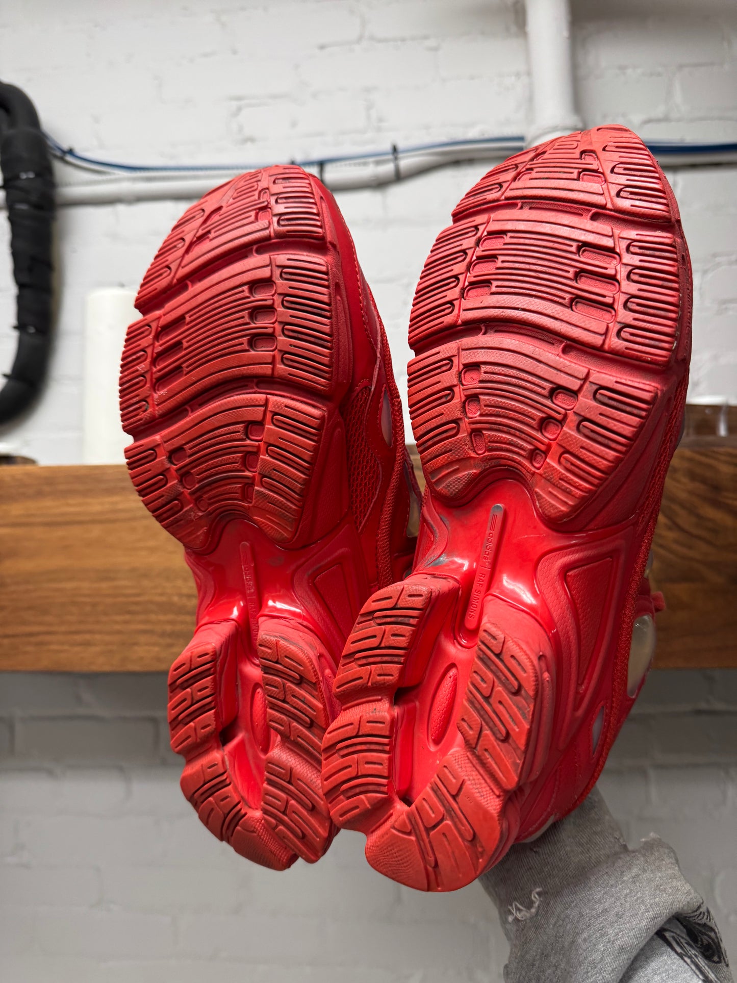 Raf Simons ‘Ozweegos V2’ Red Low Top Sneakers