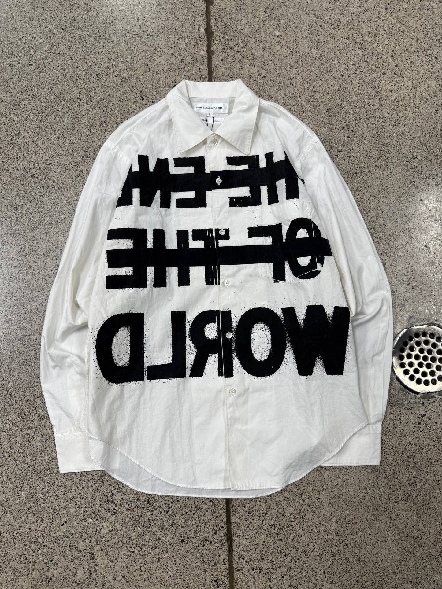 Comme Des Garçons Shirt ‘Free the World’ Painted Button Down Shirt.