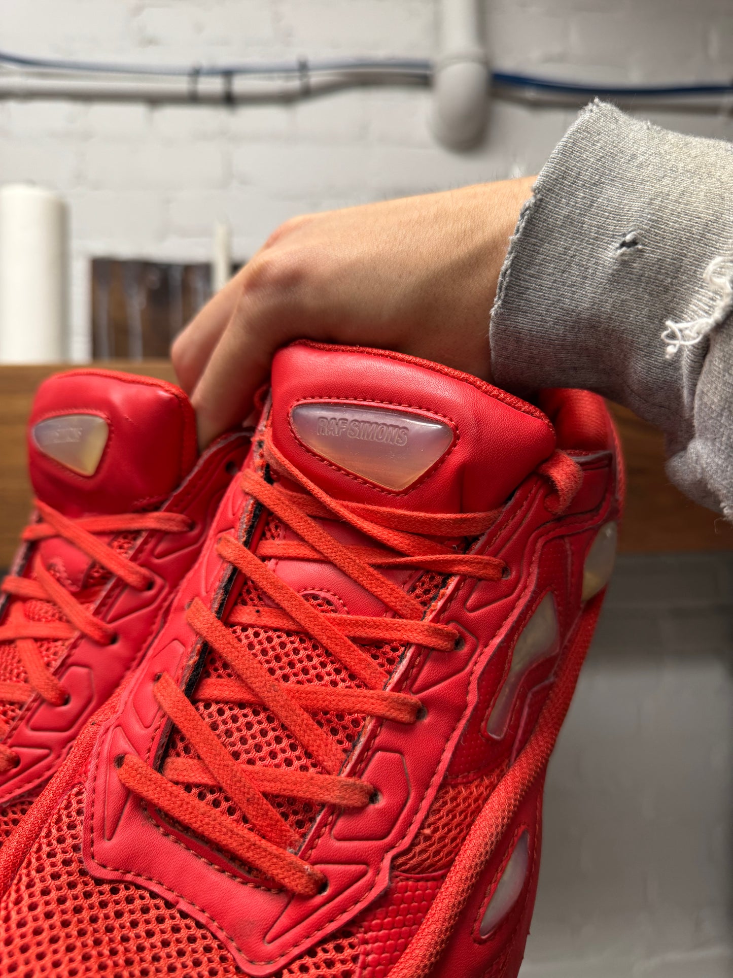Raf Simons ‘Ozweegos V2’ Red Low Top Sneakers