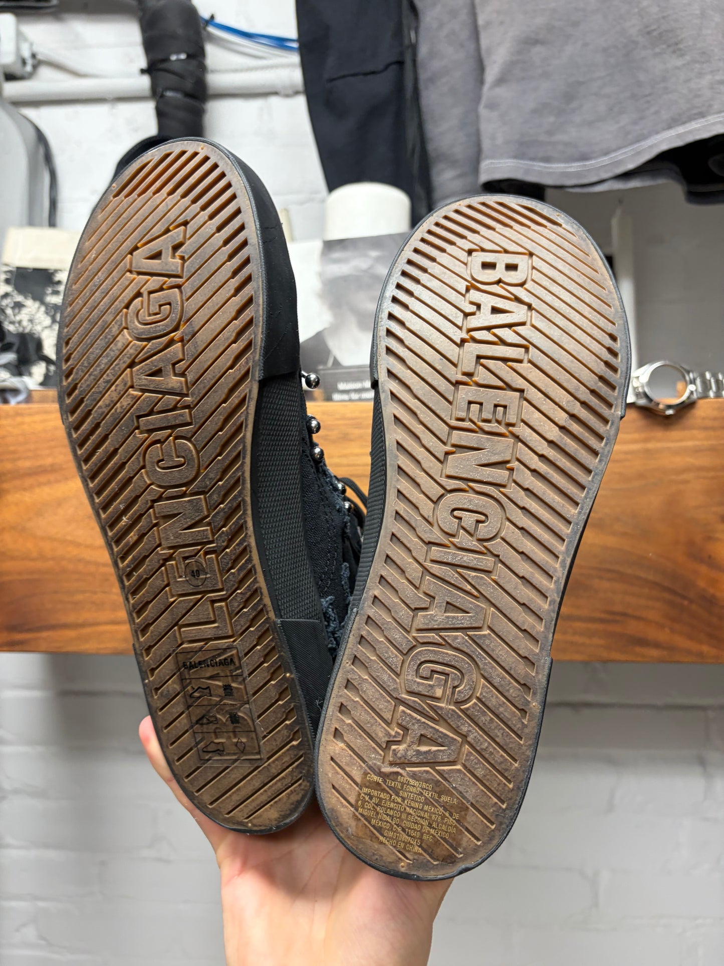 Balenciaga ‘Paris’ Pierced Black Canvas High Top Sneakers