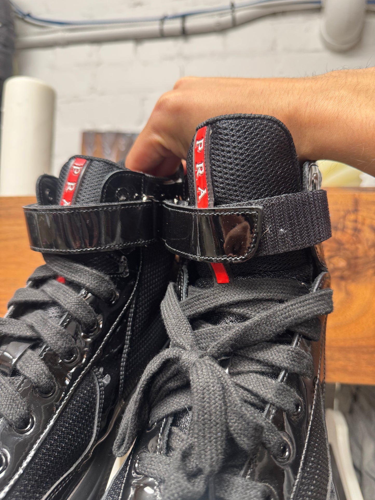 Prada ‘Americas Cup’ Black Patent Leather High Top Sneakers