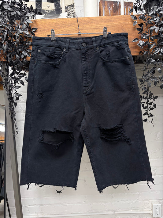 2025 Balenciaga Over Knee Length Distressed Black Raw Hem Denim Shorts