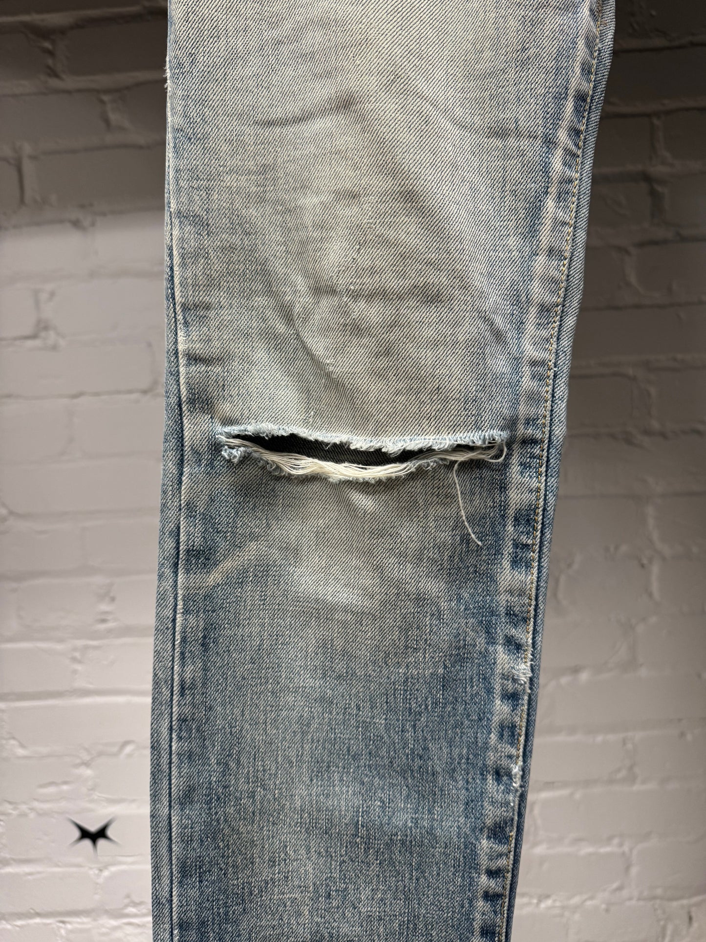 Saint Laurent ‘D02’ Distressed Light Wash Blue Denim