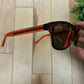 Gucci Red Tint Translucent Frame Sunglasses