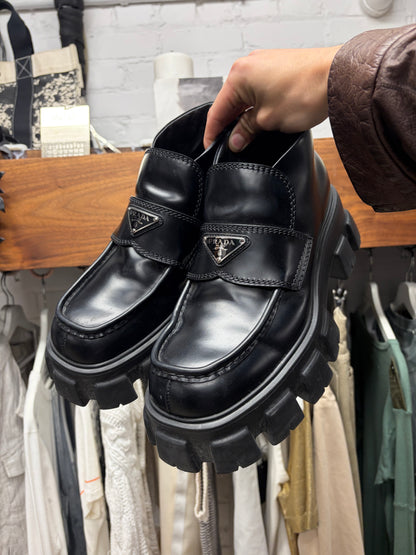 Prada ‘Monolith’ Black Leather Lug Sole Derbys