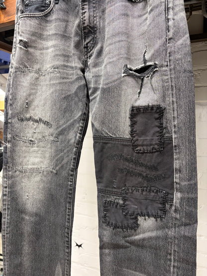 Neighborhood Patchwork Distressed Black Bootcut Denim