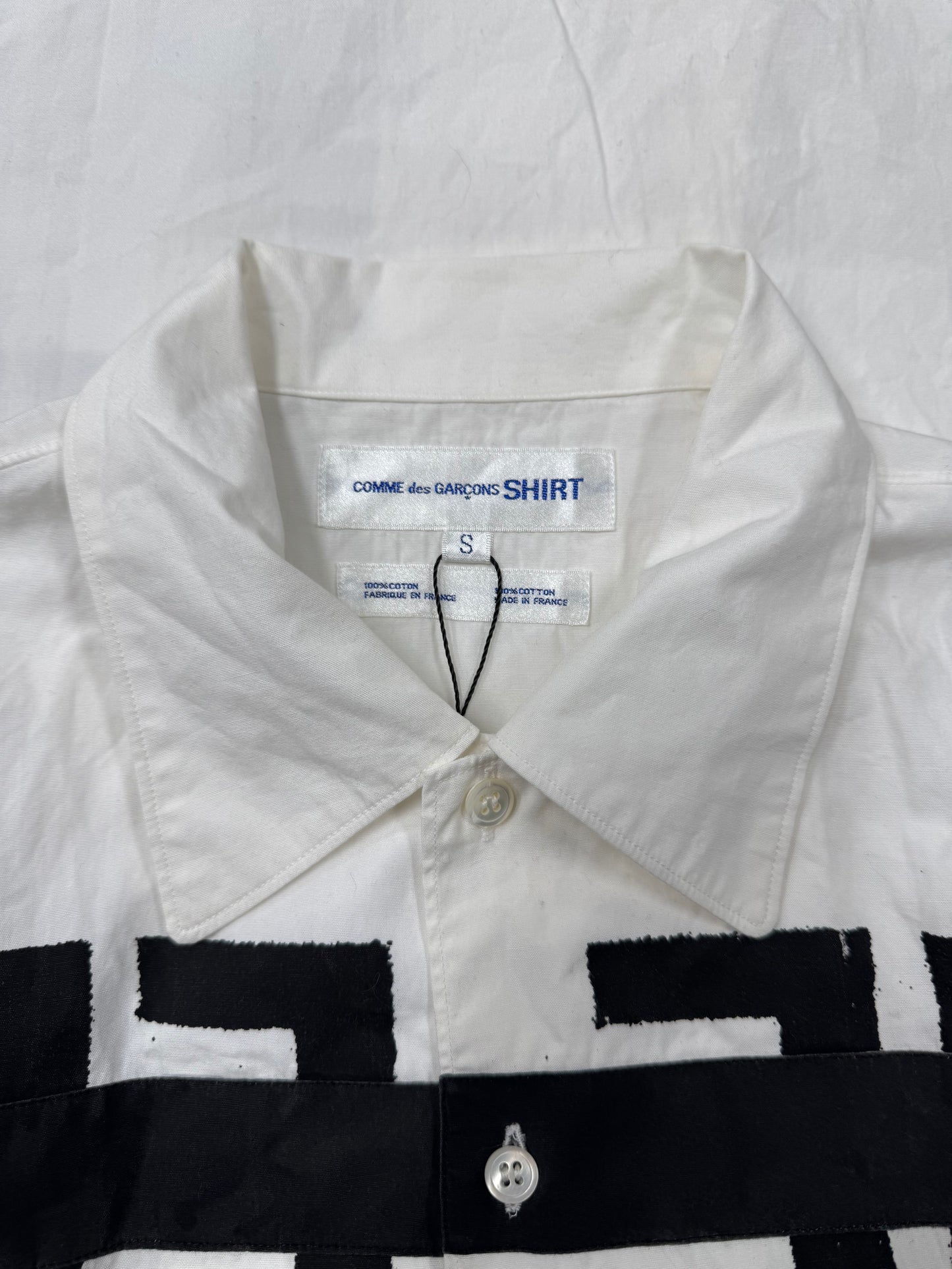 Comme Des Garçons Shirt ‘Free the World’ Painted Button Down Shirt.