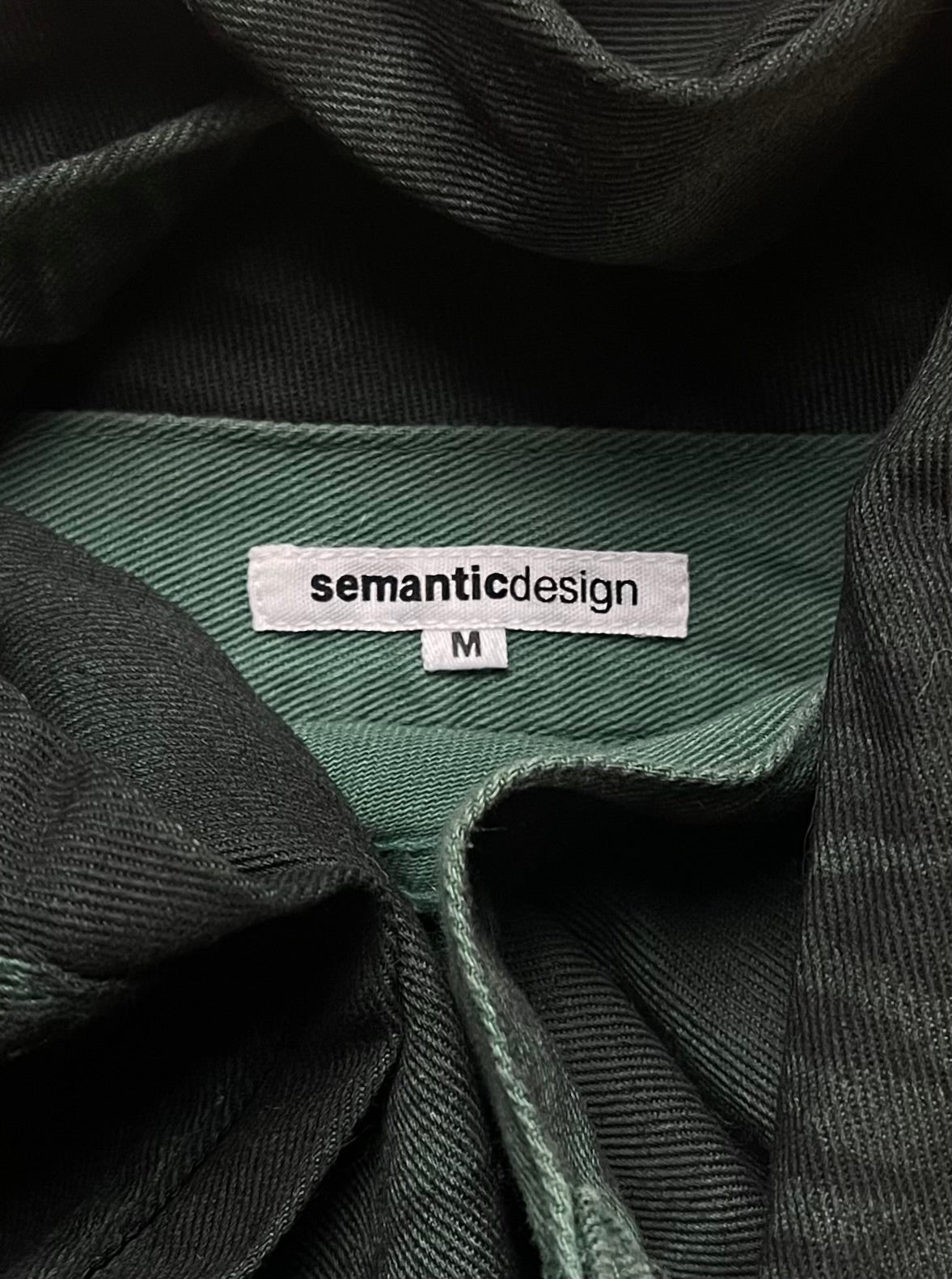 Semantic Design Washed Green Flared Denim