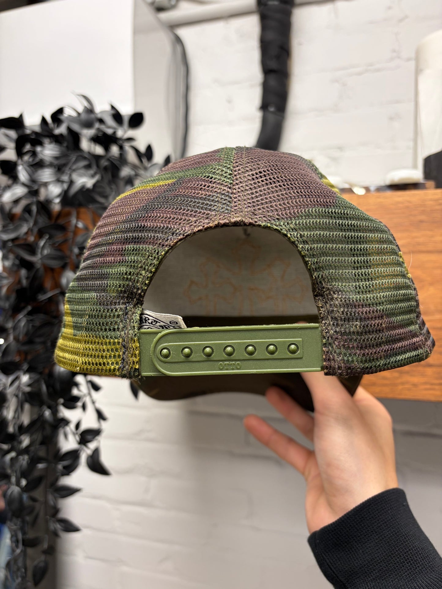 Chrome Hearts Orange ‘Cemetery’ Leather Cross Patch Camo Trucker Hat