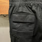SS2024 Rick Owens ‘Lido’ Waxed Black Cargo Pants