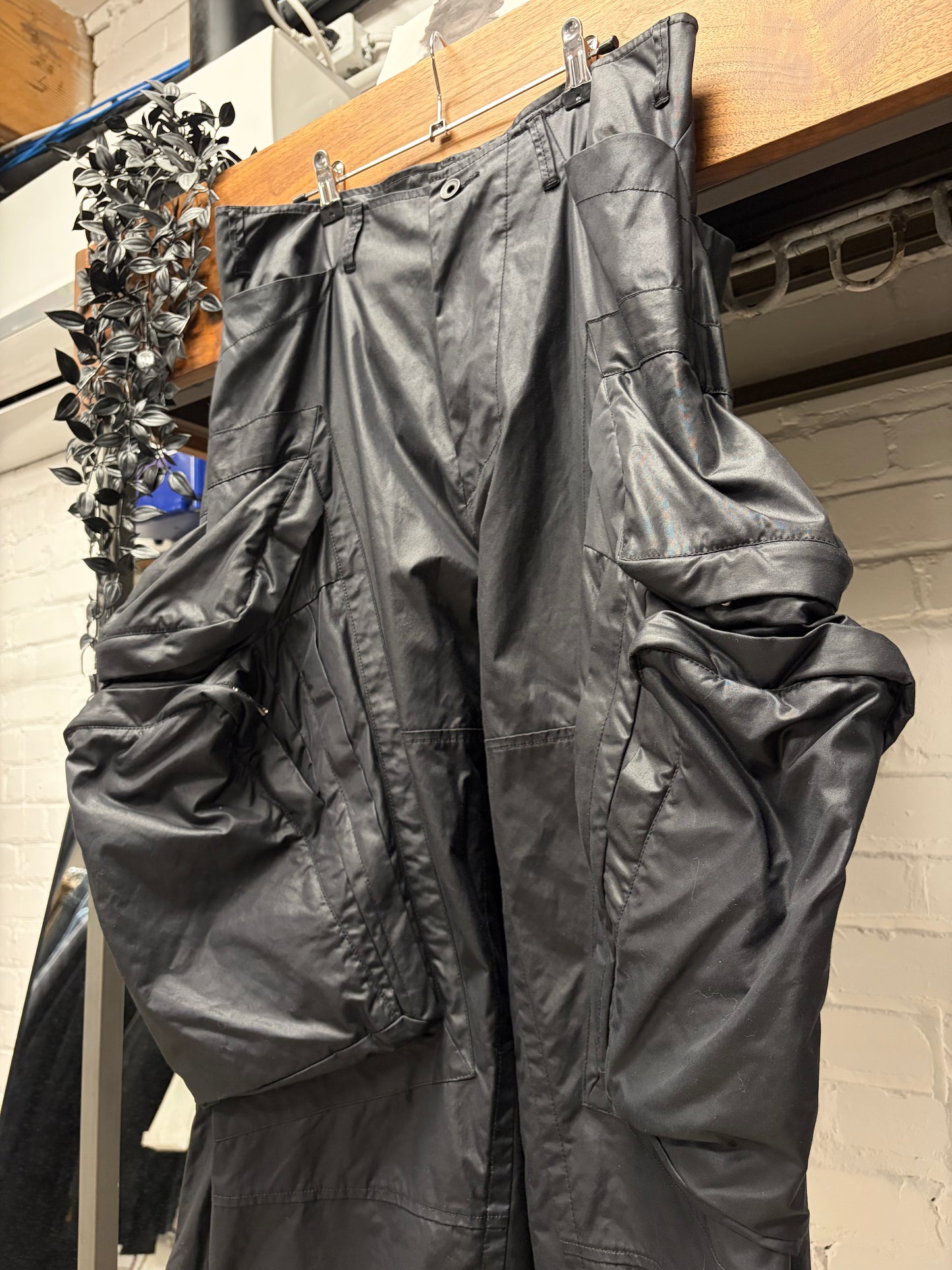 AW2022 Julius ‘Gas Mask’ Waxed Black Wide Leg Cargo Pants
