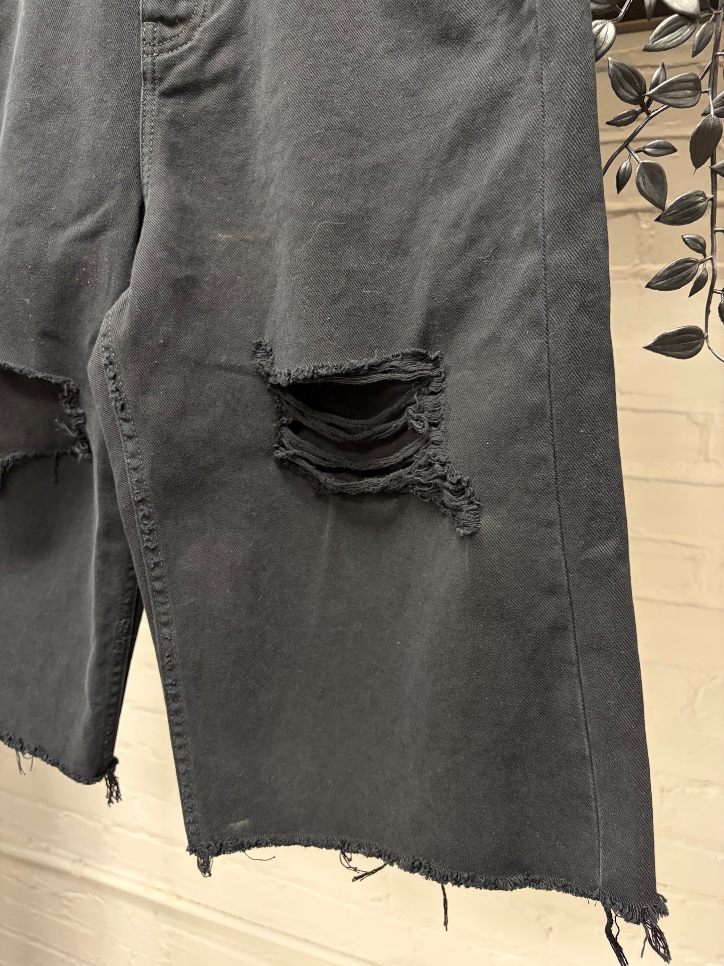 2025 Balenciaga Over Knee Length Distressed Black Raw Hem Denim Shorts