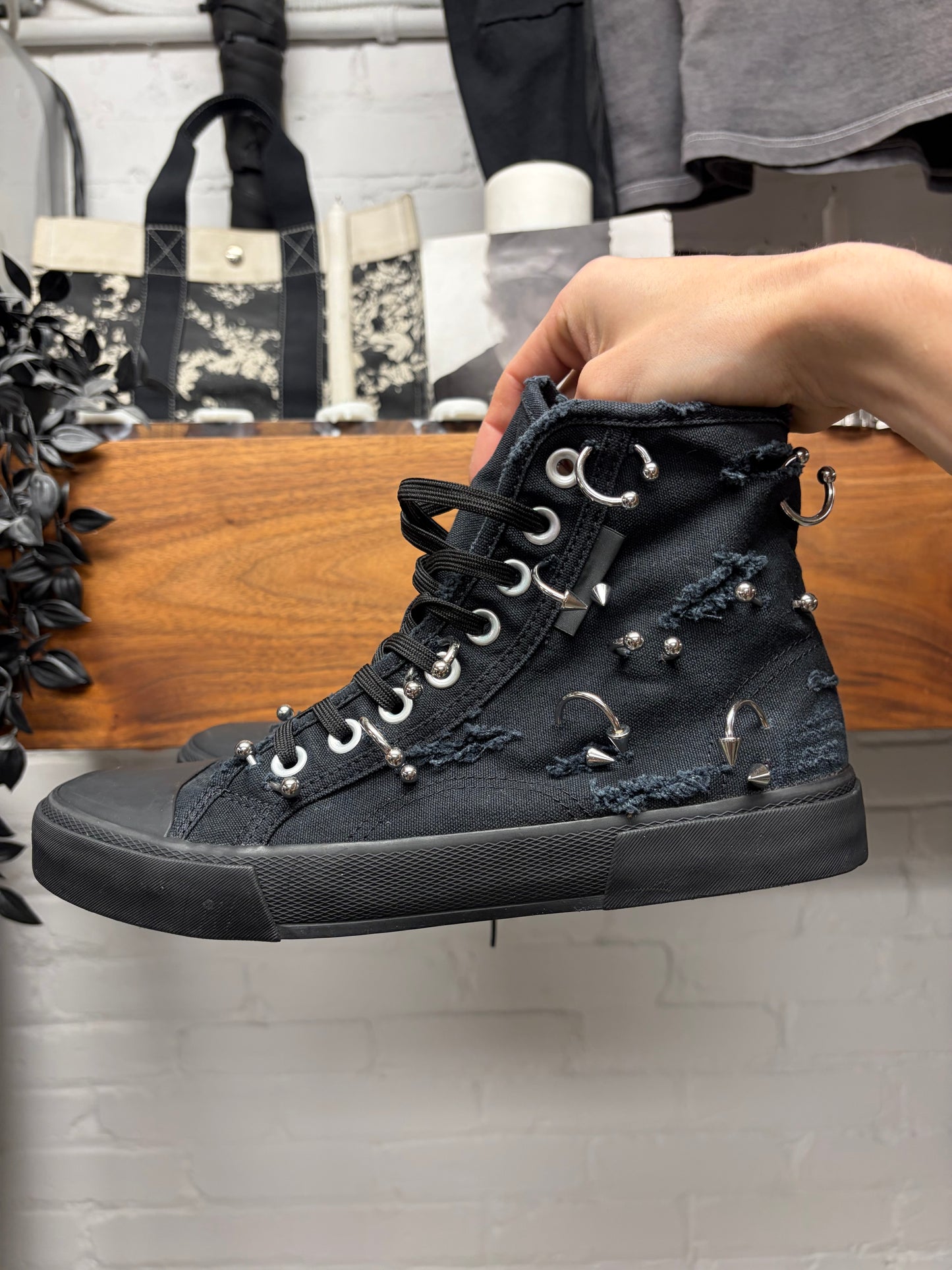 Balenciaga ‘Paris’ Pierced Black Canvas High Top Sneakers