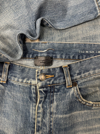 Saint Laurent ‘D02’ Distressed Blue Skinny Jeans